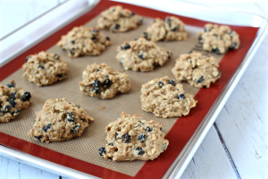 Blueberry oat cookies on a baking sheet