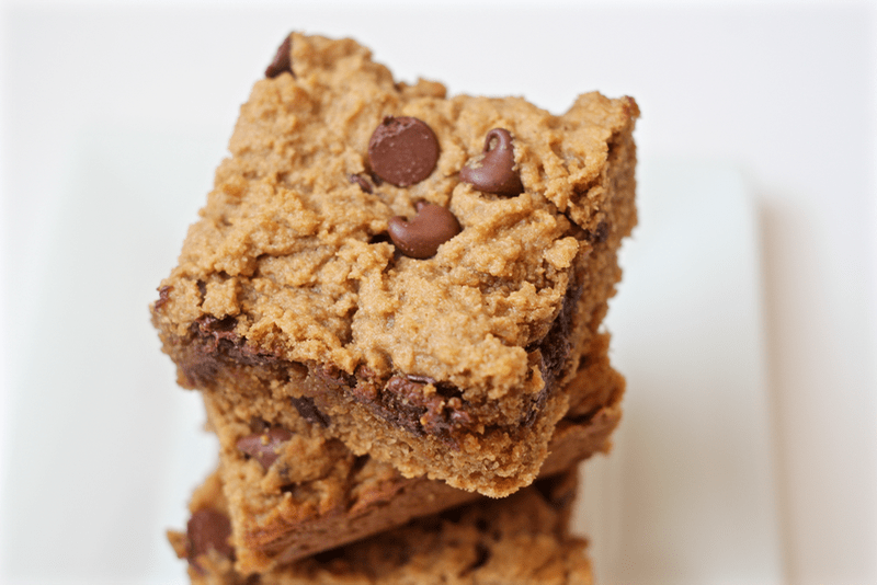 A stack of peanut butter chocolate chip snacking bars on a plate.