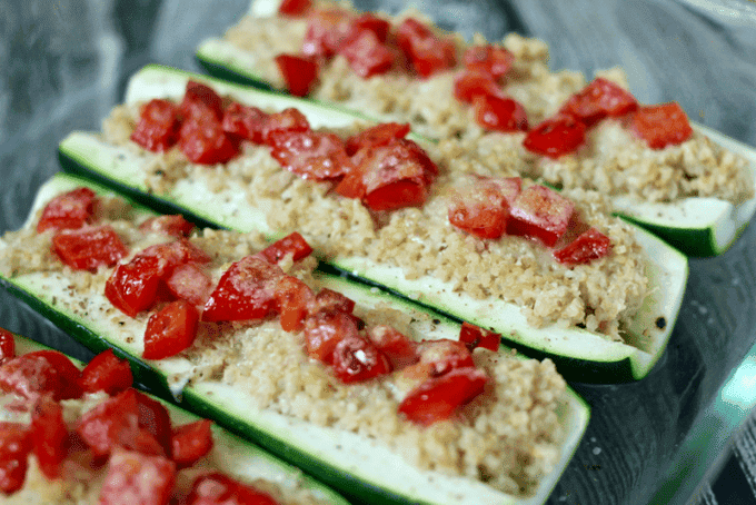 Quinoa and hummus stuffed zucchini