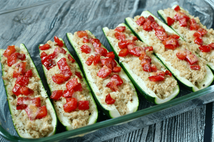 Quinoa and hummus stuffed zucchini