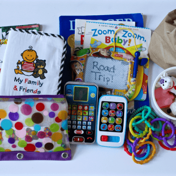 A display of different children's books, small toys and a pencil case.