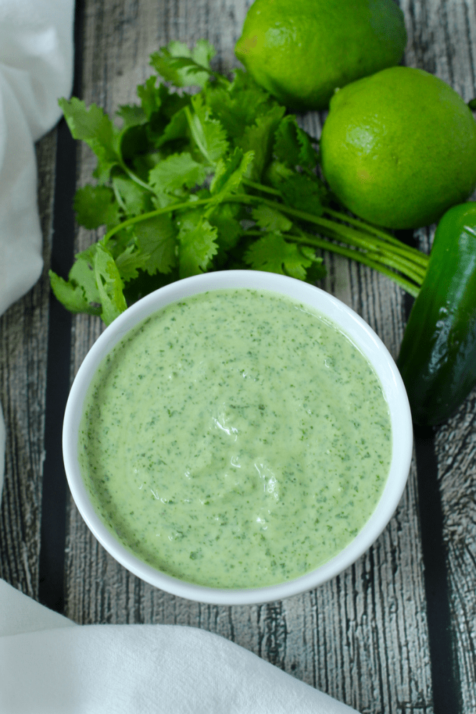 This creamy cilantro lime dressing takes just minutes to make in a blender and has a bright, fresh taste that's great for salads, grain bowls and grilled chicken and meat. #cilantrolimedressing #cilantrodressing #homemadedressing | www.familyfoodonthetable.com