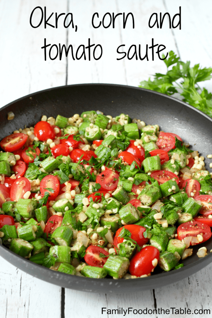 A mixture of sautéed okra, corn and tomatoes in a large skillet