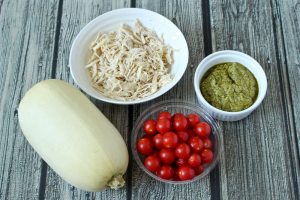 Spaghetti squash with pesto chicken and tomatoes - an easy, 4-ingredient dinner | FamilyFoodontheTable.com