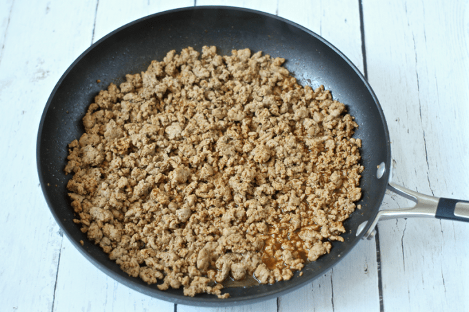 Ground turkey cooked and crumbled in a saute pan and seasoned with taco seasoning