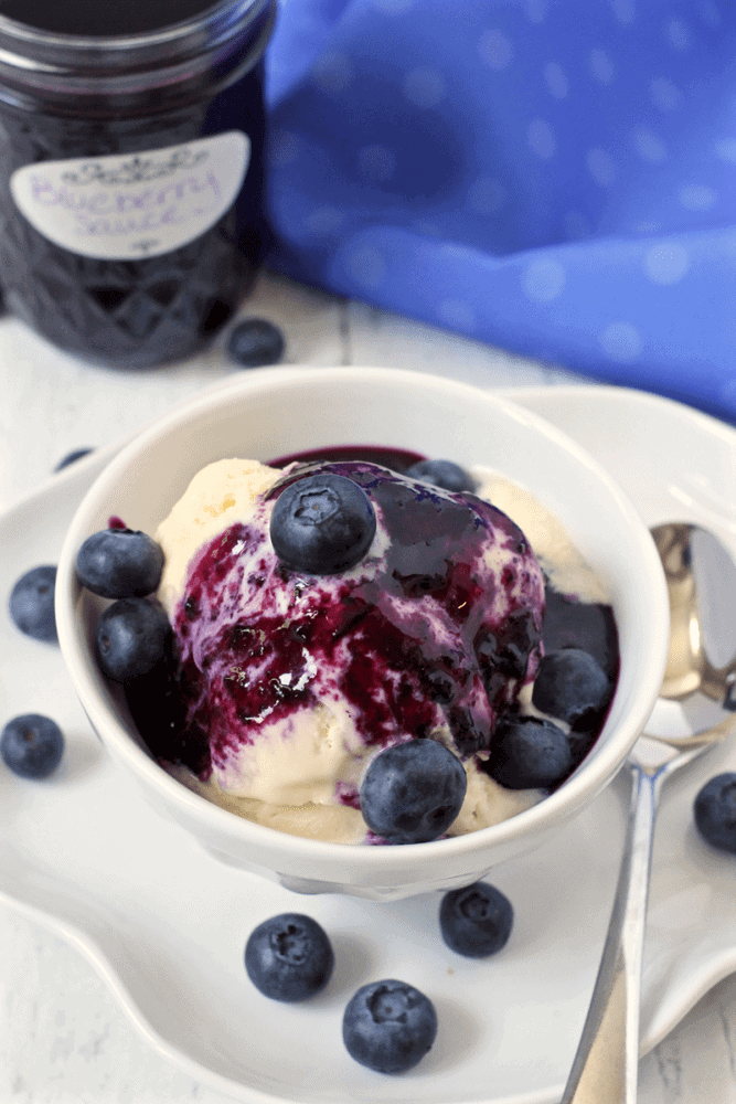 Homemade blueberry sauce over ice cream - such a delicious summer dessert! | FamilyFoodontheTable.com