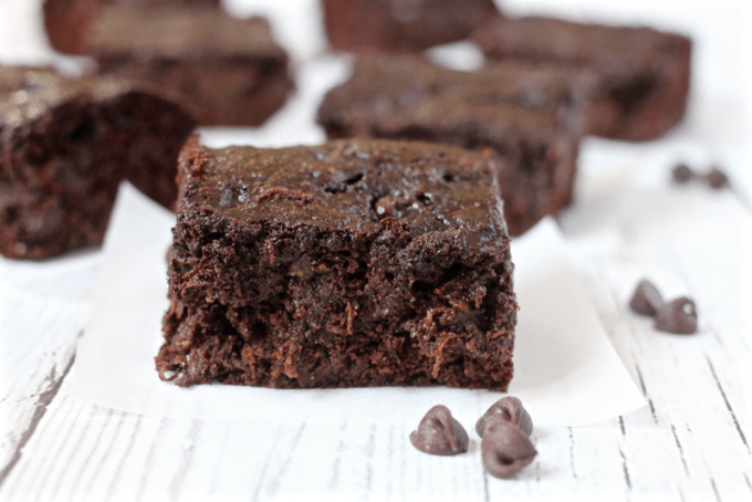 Chocolate chip zucchini brownies are rich, decadent and delicious - but secretly healthy! 100% whole grain and loaded with veggies! | www.familyfoodonthetable.com