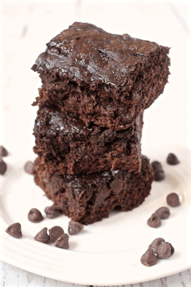 Chocolate chip zucchini brownies are rich, decadent and delicious - but secretly healthy! 100% whole grain and loaded with veggies! | www.familyfoodonthetable.com