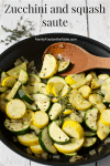 A wooden spoon resting in a large skillet of sautéed zucchini and yellow squash with thyme.