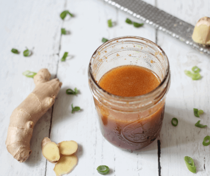 Homemade soy ginger dressing is just 5 ingredients and takes 5 minutes to put together! This delicious, easy recipe goes great with salads, grain bowls and chicken dishes. #gingerdressing #homemadedressing #asiandressing | www.familyfoodonthetable.com