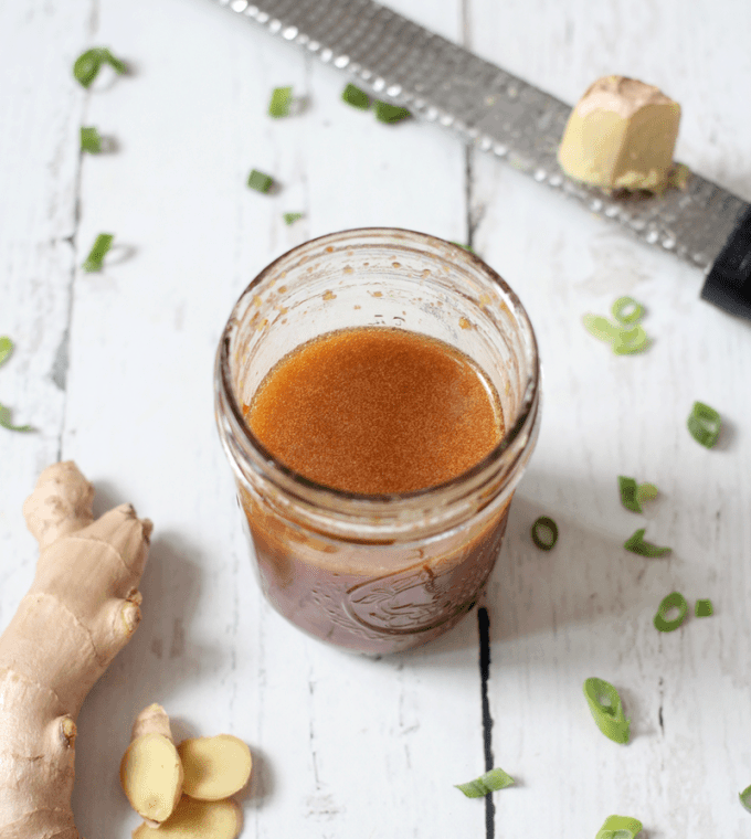 Homemade soy ginger dressing is just 5 ingredients and takes 5 minutes to put together! This delicious, easy recipe goes great with salads, grain bowls and chicken dishes. #gingerdressing #homemadedressing #asiandressing | www.familyfoodonthetable.com