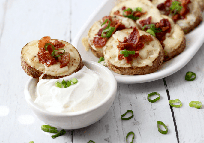 Fast cheesy bacon potato skins use as simple hack to make an easy appetizer for parties or game day! #potatoes #potatoskins #appetizers #gamedayeats