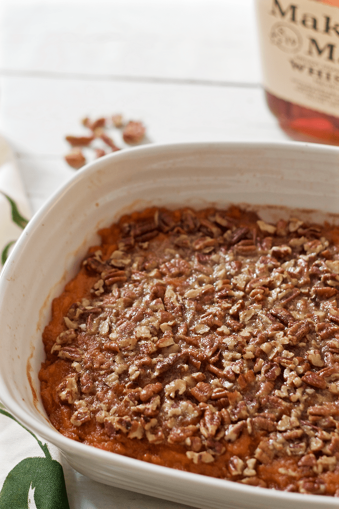 This bourbon sweet potato casserole with buttery pecans has a little less sugar and butter for a boozy, not-too-sweet holiday side dish! #bourbon #sweetpotato #casserole #thanksgivingdinner #holidayfood