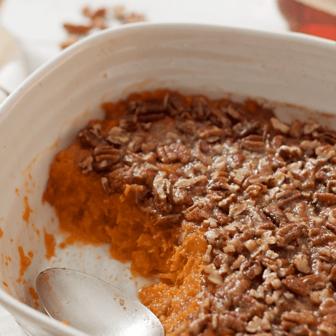 Bourbon sweet potato casserole with a buttery pecan crust - lightened up slightly with less sugar and butter for a not-too-sweet Thanksgiving side dish | FamilyFoodontheTable.com