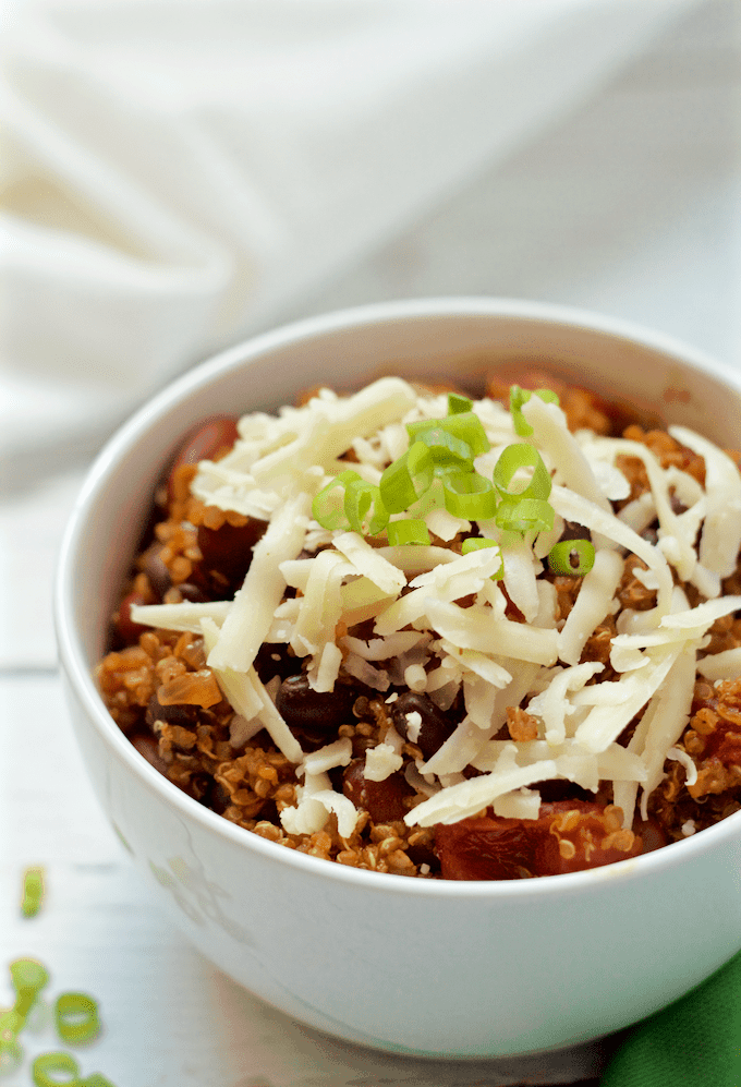 This hearty vegetarian quinoa chili has such deep color and flavor that it'll be a hit with meat eaters and vegetarians alike! Just 30 minutes to make and no need to pre-cook the quinoa! #vegan #vegetarian #chili #quinoa