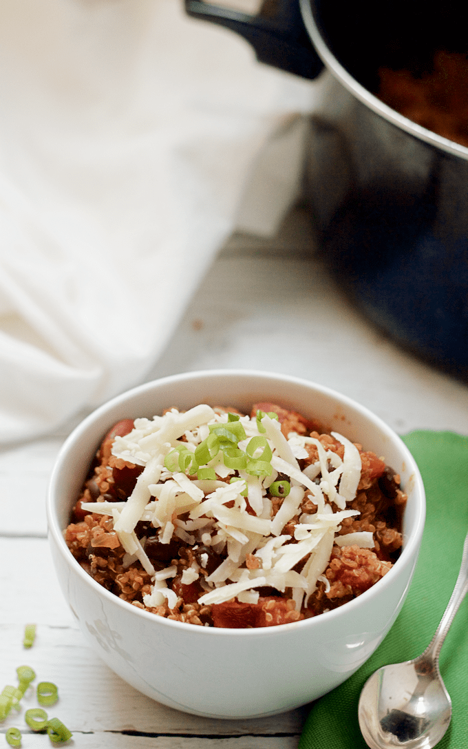 This hearty vegetarian quinoa chili has such deep color and flavor that it'll be a hit with meat eaters and vegetarians alike! Just 30 minutes to make and no need to pre-cook the quinoa! #vegan #vegetarian #chili #quinoa