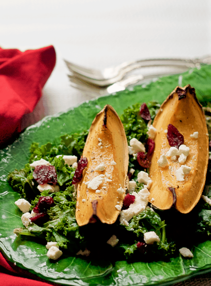Roasted acorn squash and kale salad with feta cheese and dried cranberries - a festive holiday side dish! | FamilyFoodontheTable.com