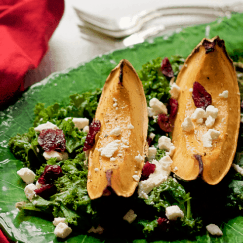 Roasted acorn squash and kale salad with feta cheese and dried cranberries - a festive holiday side dish! | FamilyFoodontheTable.com