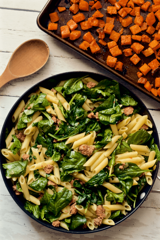 A flavorful all-in-one dinner of turkey sausage, roasted butternut squash and spinach with gluten-free pasta | FamilyFoodontheTable.com
