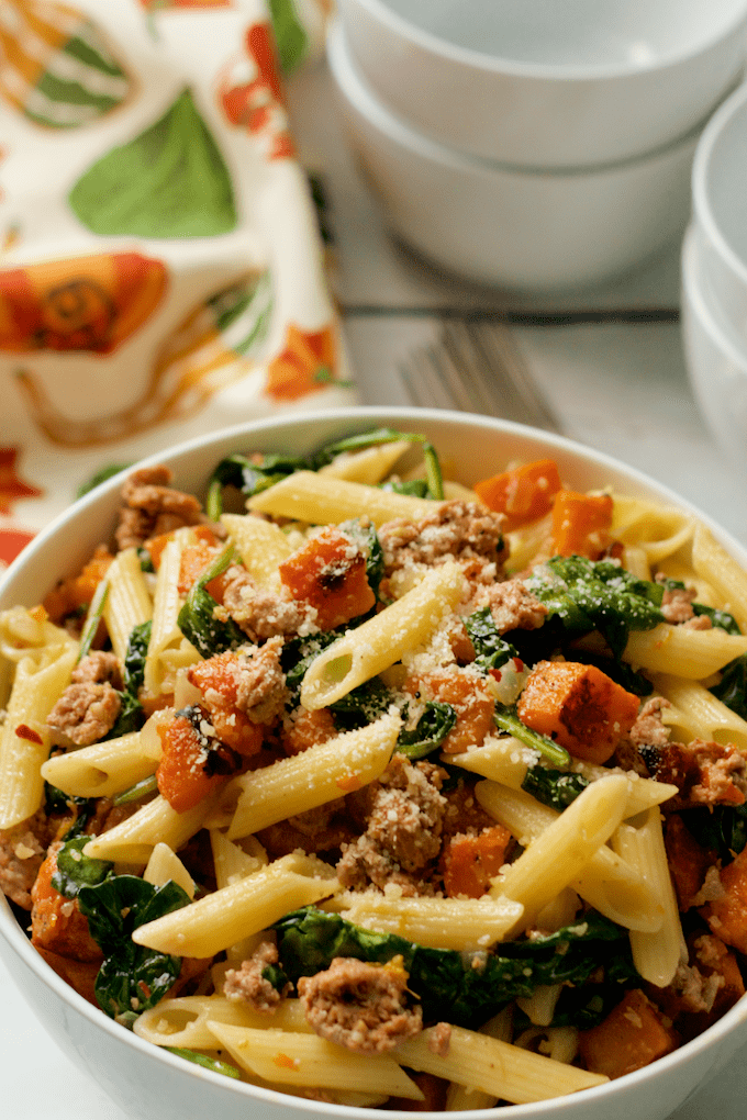 A flavorful all-in-one dinner of turkey sausage, roasted butternut squash and spinach with gluten-free pasta | FamilyFoodontheTable.com