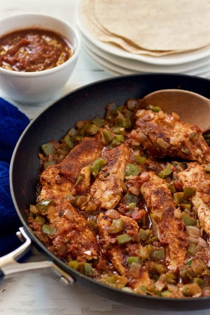 Easy, fast salsa chicken with onion, peppers and jalapeños is perfect for wraps or over rice. A great weeknight dinner! | FamilyFoodontheTable.com