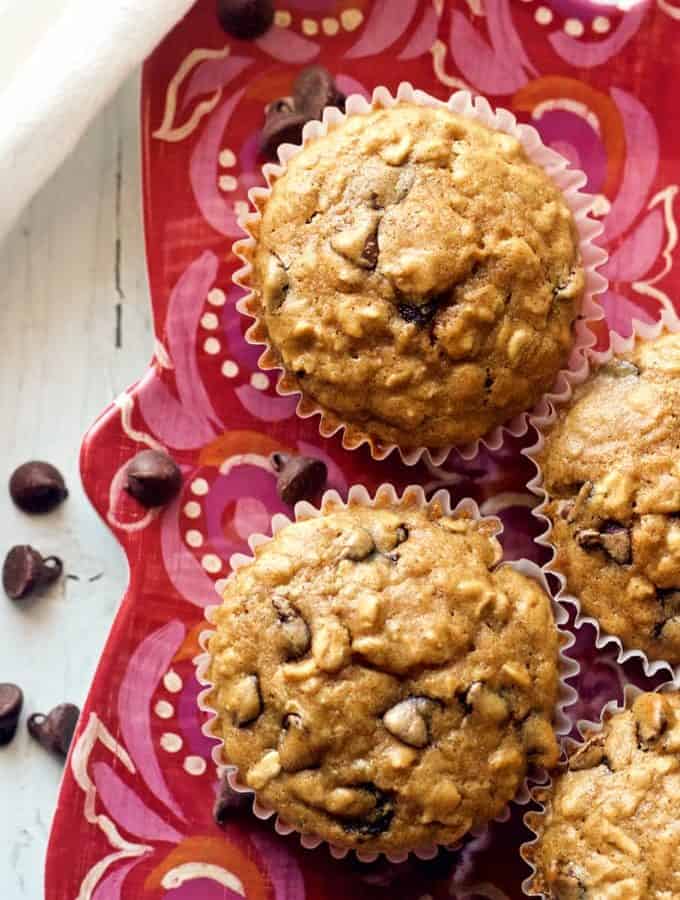 Healthy chocolate chip muffins -- made with wheat flour, oats and just a tiny bit of butter for a fun breakfast or easy afternoon snack! | FamilyFoodontheTable.com