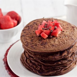 Whole wheat, naturally sweetened chocolate pancakes, with no butter or oil for a healthy, fun breakfast! | FamilyFoodontheTable.com