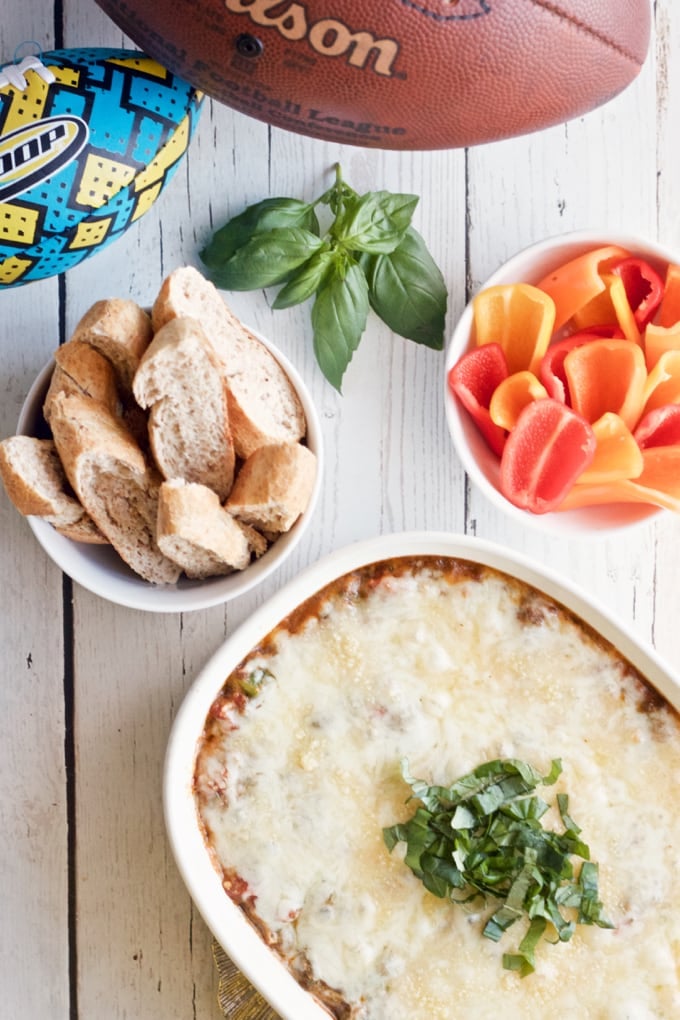 Veggie loaded pizza dip - super easy to make (and can be prepped ahead) | FamilyFoodontheTable.com