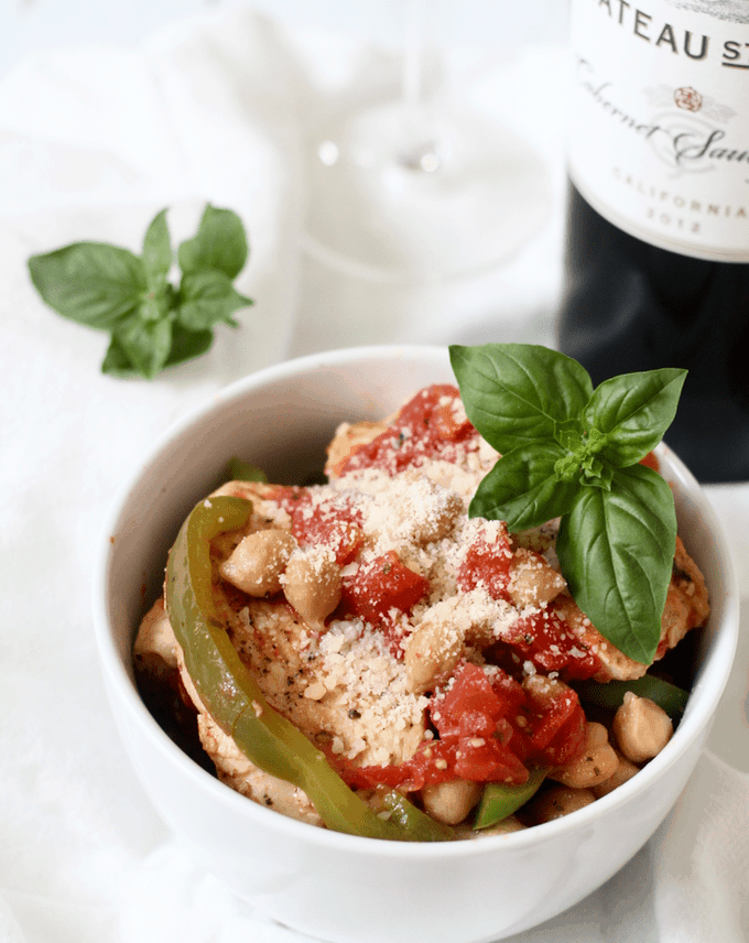 A bowl of Italian chicken with chickpeas, peppers and tomatoes