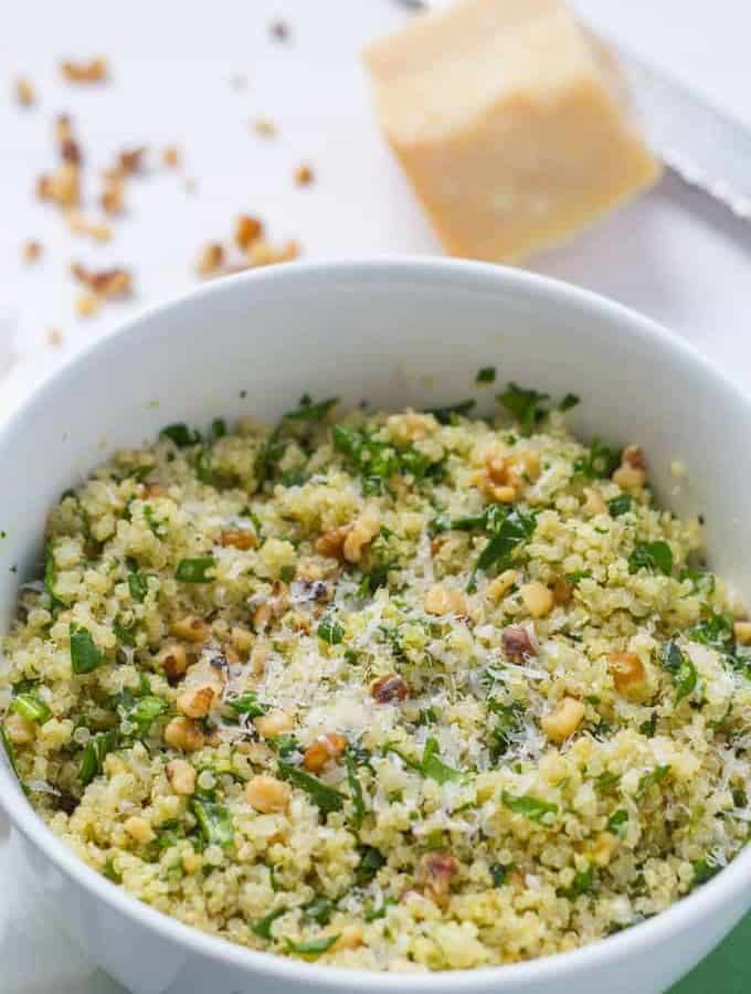 This light, flavorful quinoa spinach salad with pesto and nuts makes an easy weeknight side dish or lovely vegetarian lunch! #quinoasalad #pesto #healthyrecipes #vegetarianrecipes