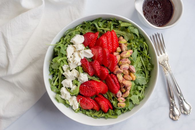Arugula salad with strawberries, goat cheese and pistachios | FamilyFoodontheTable.com