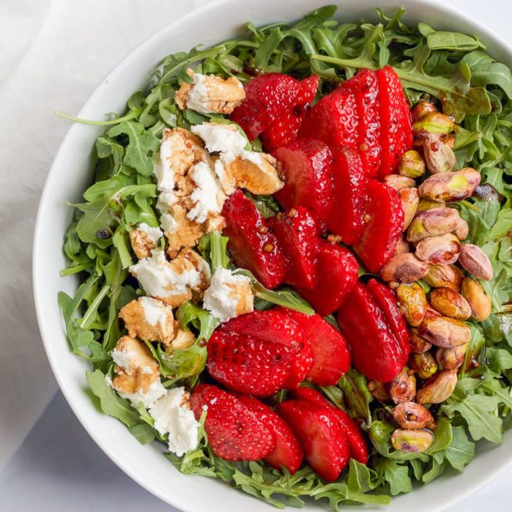 Arugula salad with strawberries, goat cheese and pistachios | FamilyFoodontheTable.com