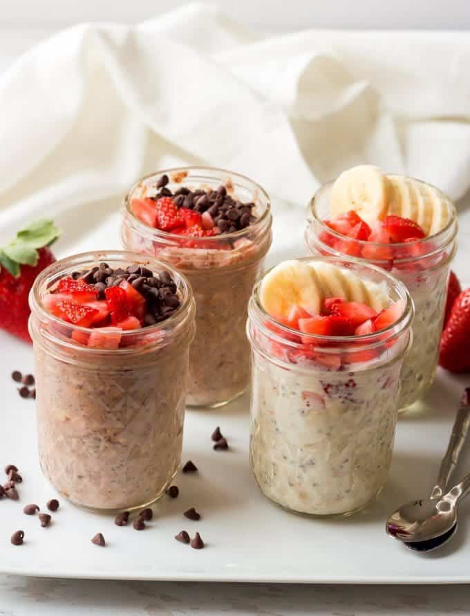 Two varieties of strawberry overnight oatmeal jars for an easy, healthy, make-ahead breakfast! | FamilyFoodontheTable.com