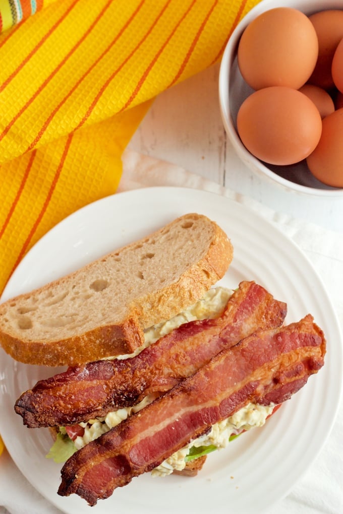 Creamy egg salad is paired with fresh tomatoes, soft Bibb lettuce and crispy strips of bacon for a stellar sandwich!