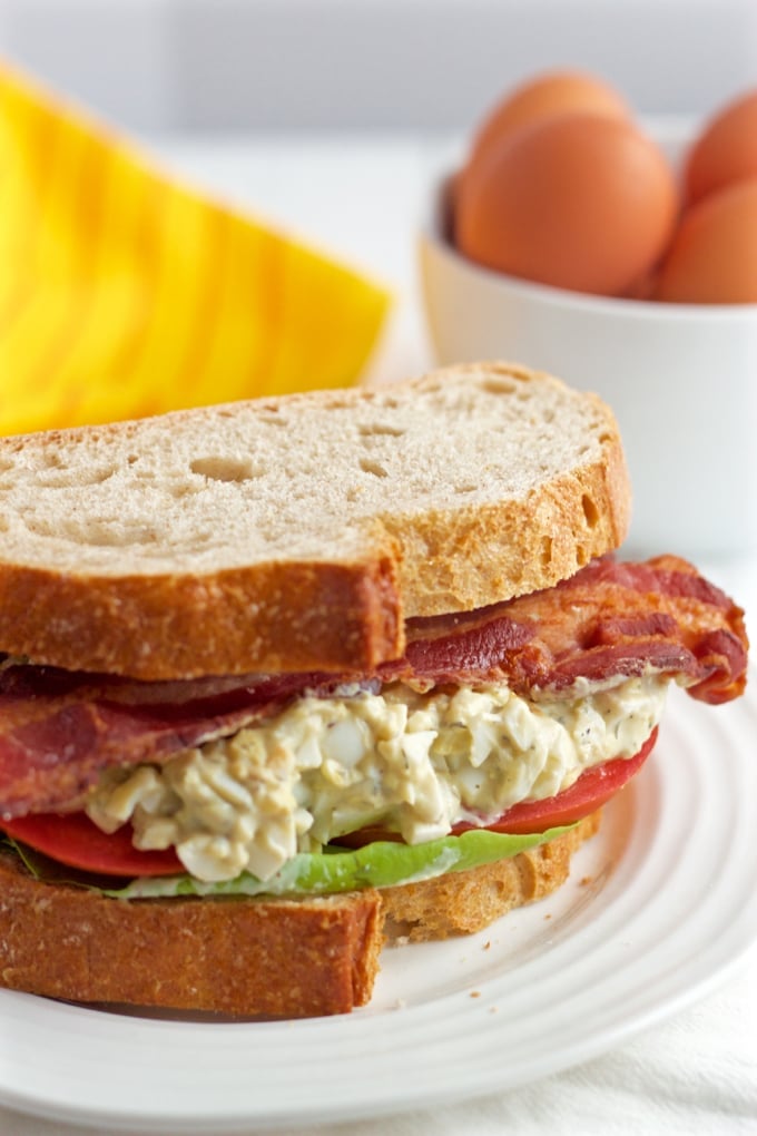 Creamy egg salad is paired with fresh tomatoes, soft Bibb lettuce and crispy strips of bacon for a stellar lunch sandwich!