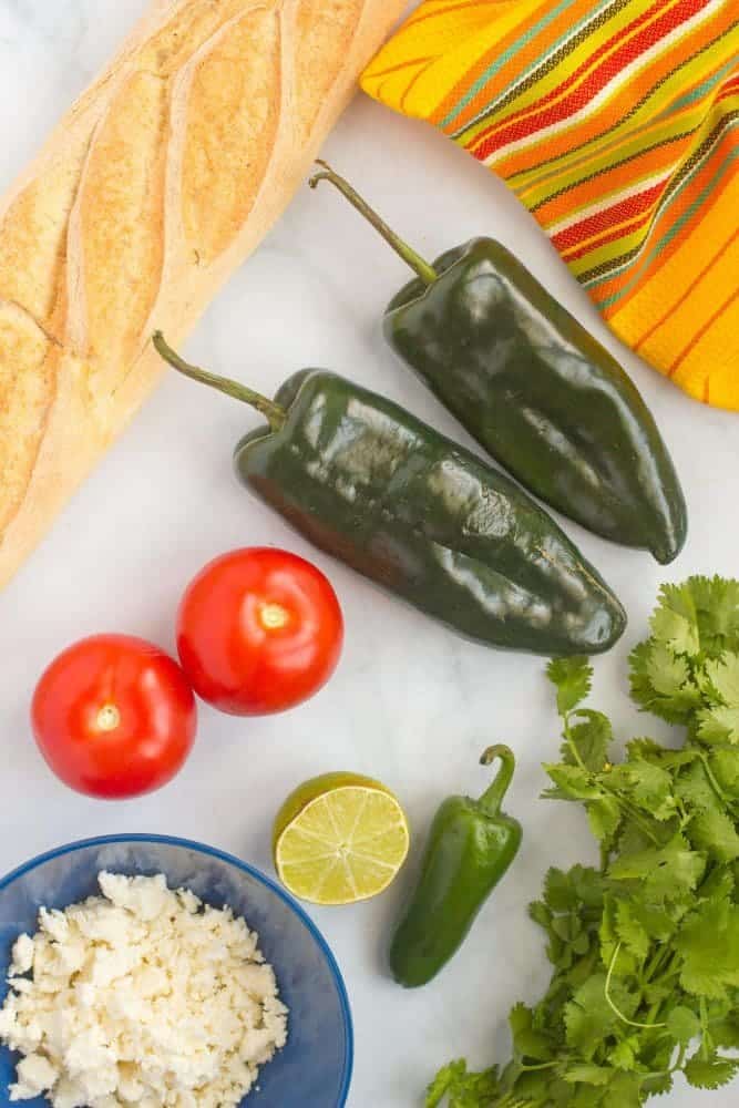 Ingredients laid out for making a bruschetta appetizer