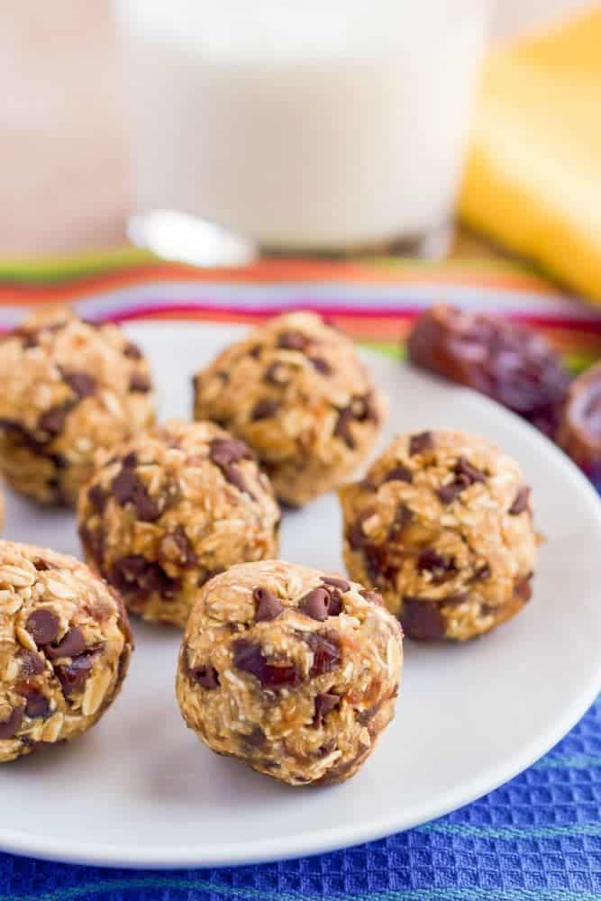 Close of healthy chocolate chip cookie balls being served on a white plate