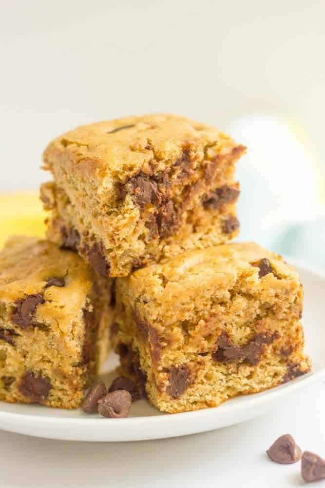 This easy banana chocolate chip snack cake is fluffy, moist and full of chocolate chips! It's whole wheat and naturally sweetened and makes a great sweet treat any time of day! #banana #snack #healthysnack #kids #cake