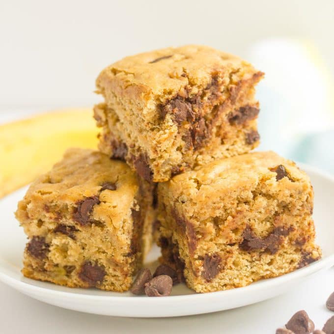 This easy banana chocolate chip snack cake is fluffy, moist and full of chocolate chips! It's whole wheat and naturally sweetened and makes a great sweet treat any time of day! #banana #snack #healthysnack #kids #cake