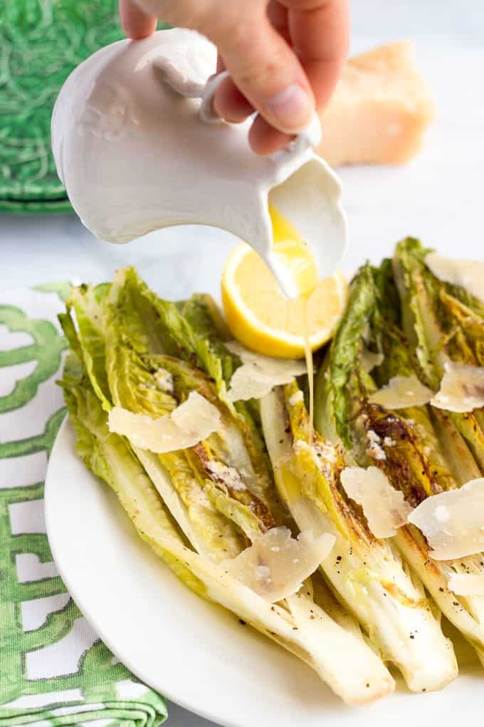 Easy seared or grilled romaine salad with cheater's Caesar dressing - great summer side! | FamilyFoodontheTable.com