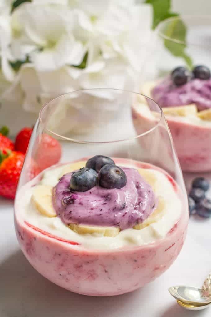 Healthy yogurt parfaits with an all natural strawberry, honey-banana and blueberry layer - a fun breakfast or snack for kids of all ages!