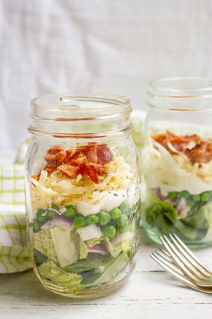 Healthier 7 layer salad - packed in mason jars for a summer picnic or an easy lunch!