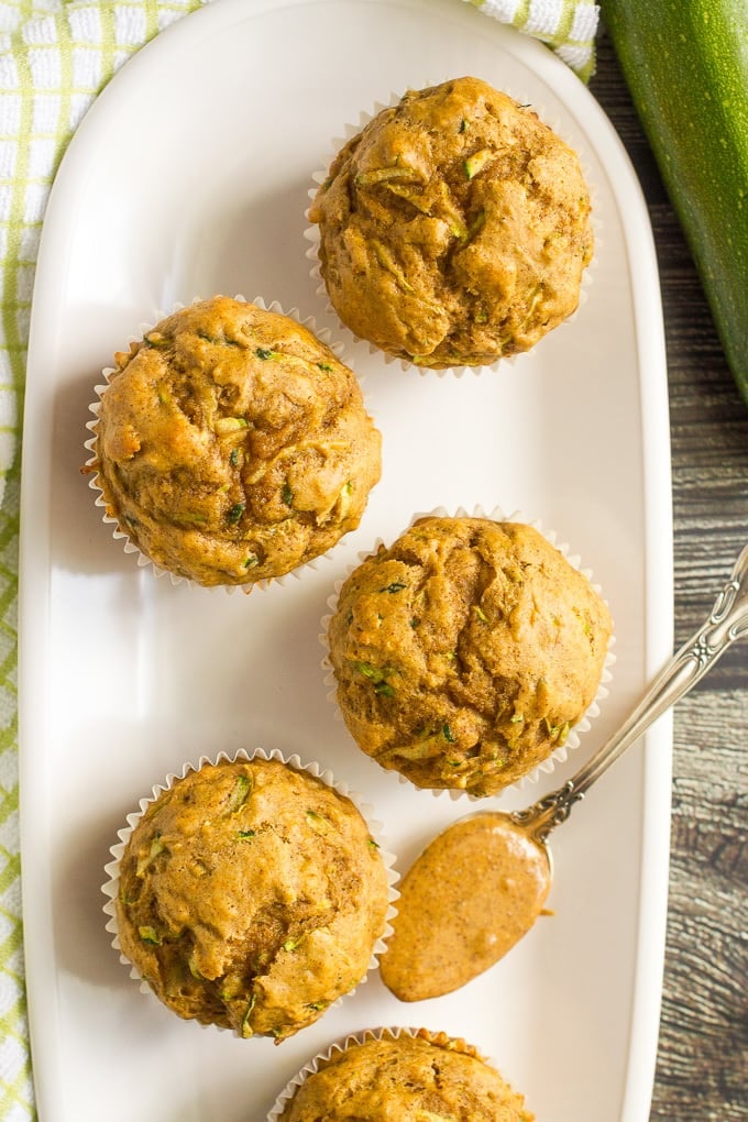 Whole wheat zucchini muffins with almond butter -- a delicious and protein-packed breakfast or school lunch option!