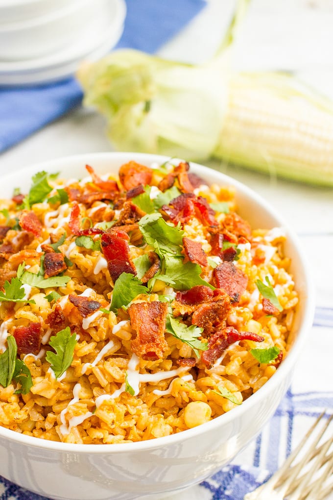 Bacon rice with corn is a summer side dish favorite that can be enjoyed year-round. Add your favorite toppings and dig in!