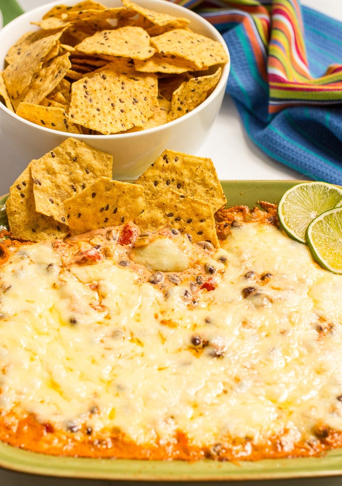 Cheesy baked black bean dip -- hot and bubbly and served with tortilla chips for an easy appetizer (great game day eats!)