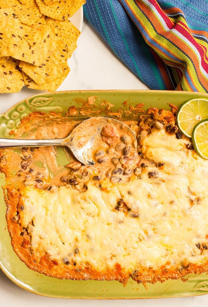 Cheesy baked black bean dip -- hot and bubbly and served with tortilla chips for an easy appetizer (great game day eats!)