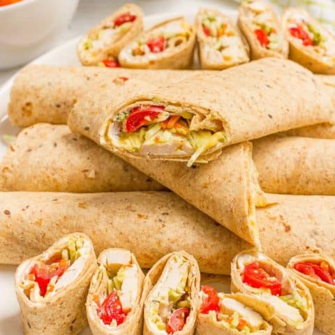 Easy chicken roll ups with cream cheese and veggies - great for lunch, appetizers or tailgating