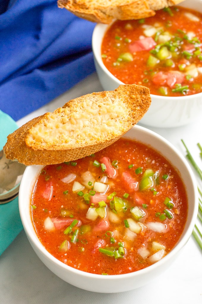 Easy tomato gazpacho soup - a cold summer soup recipe with plenty of fresh veggies and lots of topping and serving ideas!