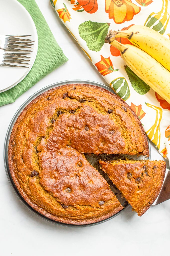 A slightly healthier banana pumpkin chocolate chip cake recipe with rich chocolate flavor and tall thick slices - a delicious fall dessert!