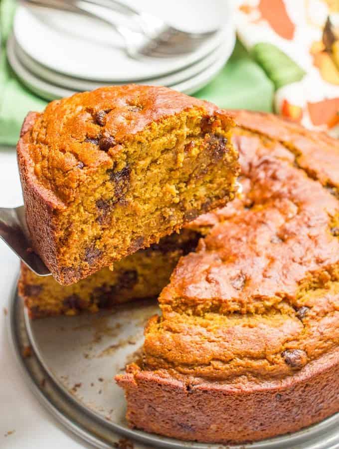 A slightly healthier banana pumpkin chocolate chip cake recipe with rich chocolate flavor and tall thick slices - a delicious fall dessert!